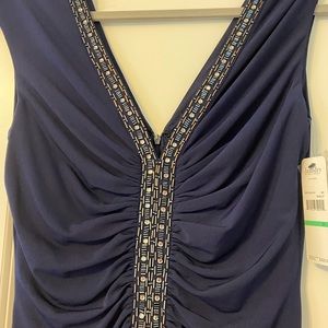 Evening dress in navy blue with crystal brocade.